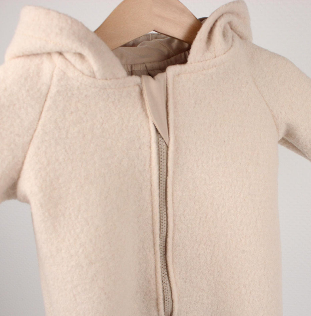 Beige Italian wool overall with front zip and cuffs, front view - AnnaKarinna