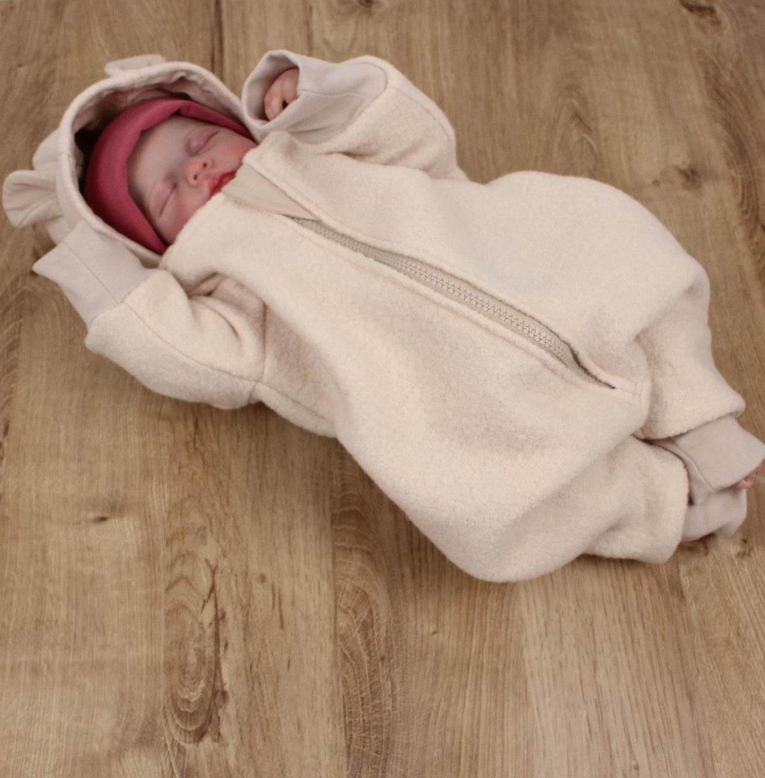 Baby wearing the beige embroidered Italian wool overall with bear-ear hood - AnnaKarinna